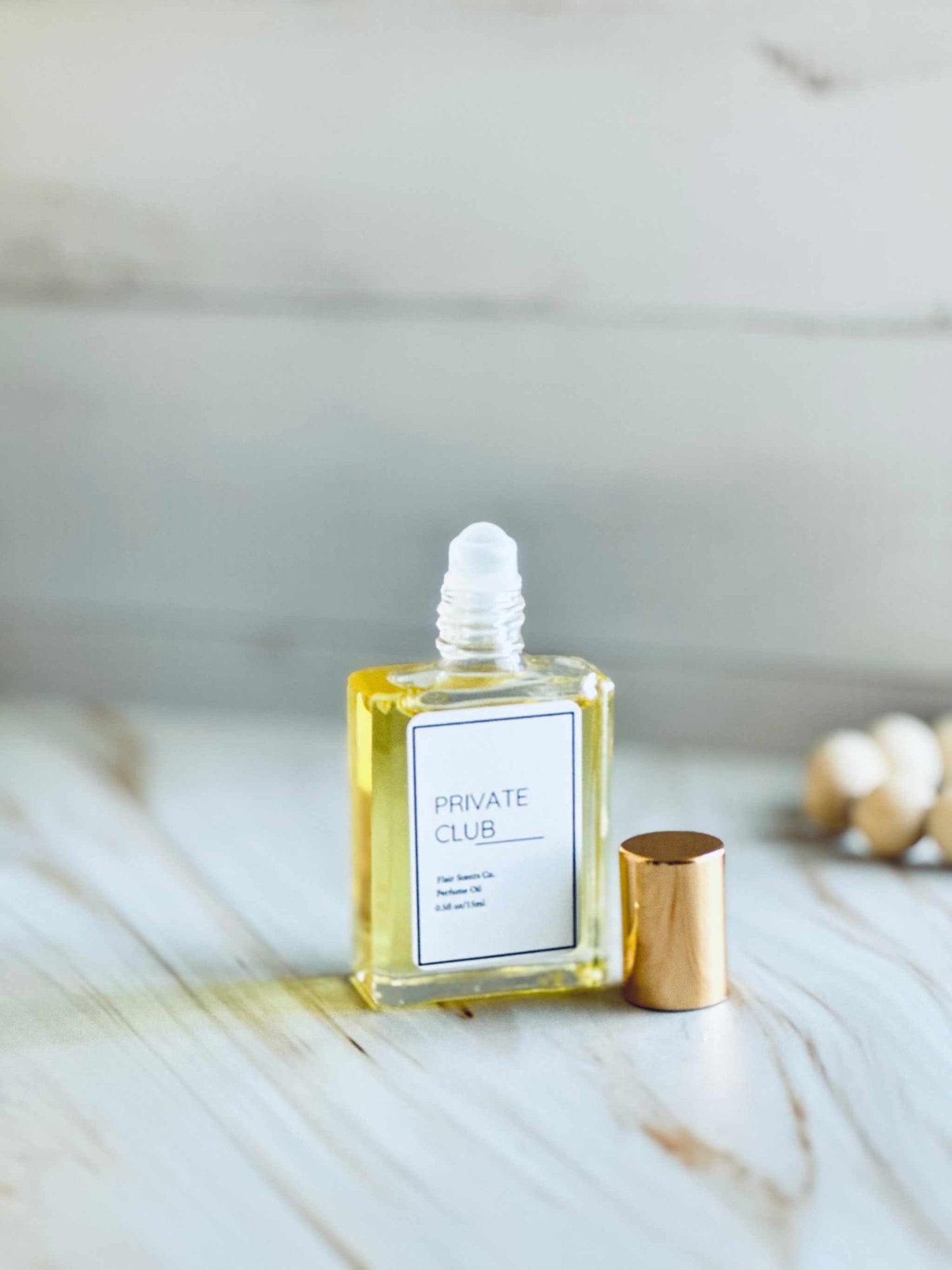 Private Club Perfume Oil™ bottle showcasing luxurious concentrated fragrance for long-lasting wear.