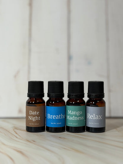 Essential oil blend diffuser bottles with Date Night Raspberry, Breathe Peppermint, Mango Madness Pineapple, and Relax Eucalyptus scents