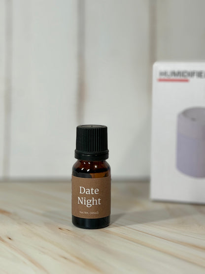 Bottle of Date Night essential oil blend with diffuser in background