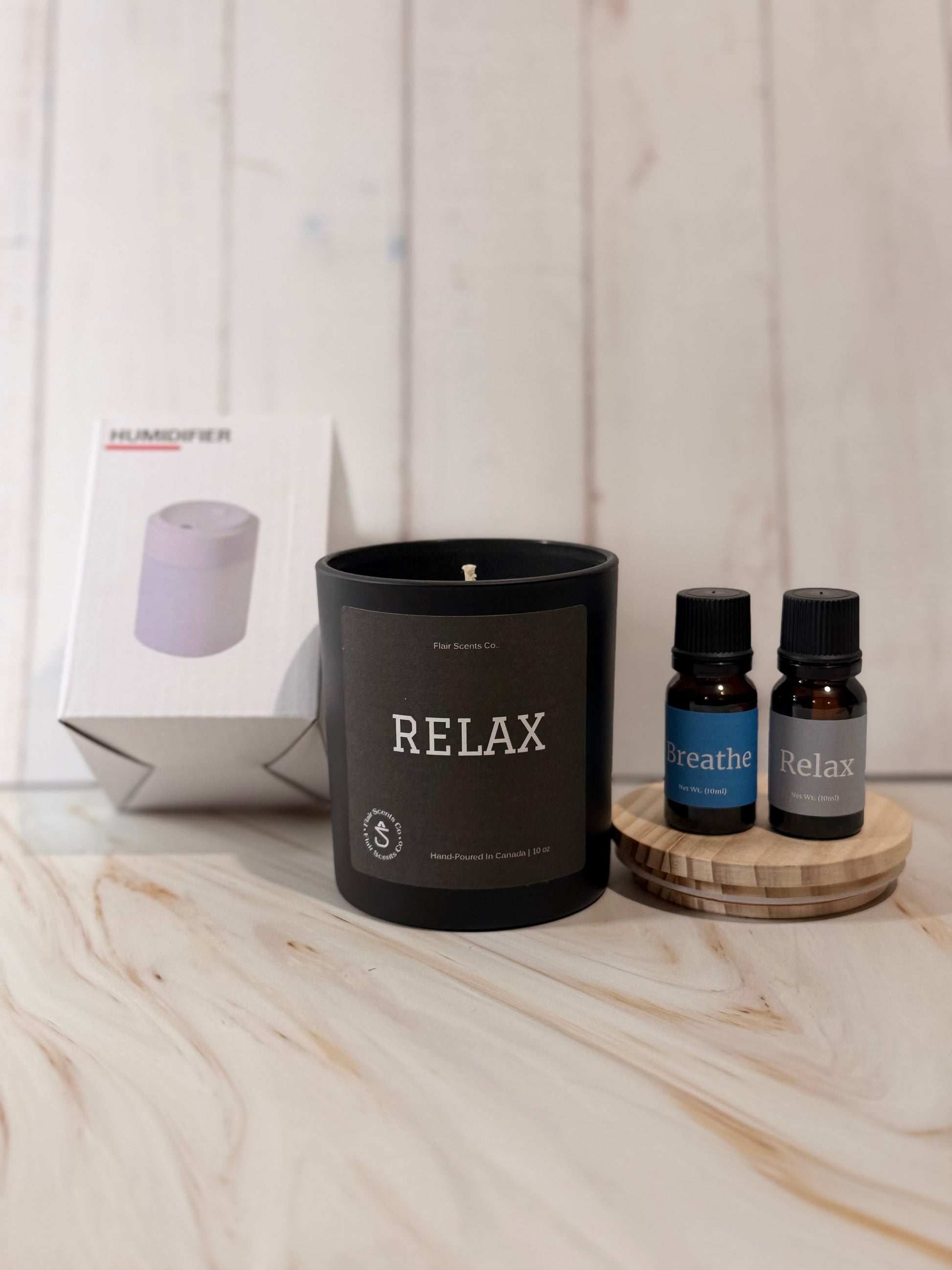 Reset Ritual self-care bundle with Relax candle, Breathe and Relax essential oils, and mini humidifier for calming atmosphere and mindfulness