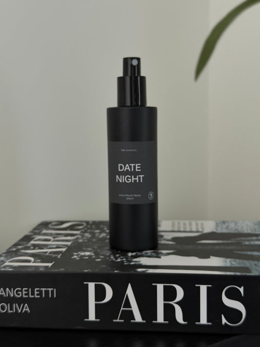 Bottle of Date Night room spray with enchanting scent of jasmine, raspberry, and rose petals