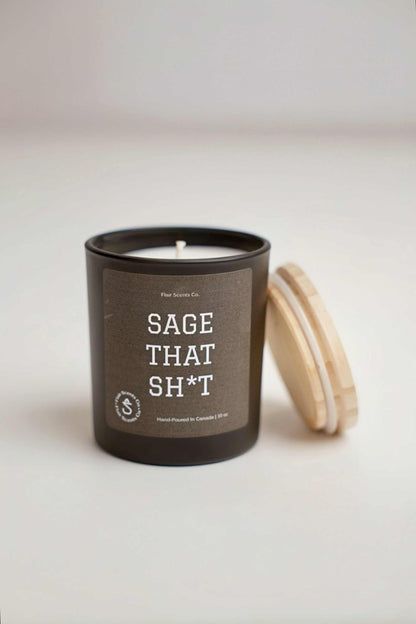 Sage That Sh*t soy candle with sage, leather, mahogany, and teakwood scent in black jar with wooden lid