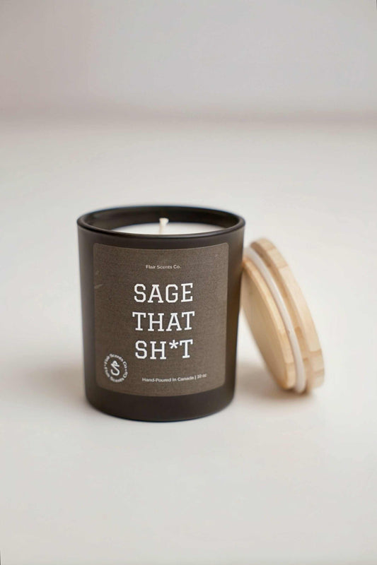 Sage That Sh*t soy candle with sage, leather, mahogany, and teakwood scent in black jar with wooden lid
